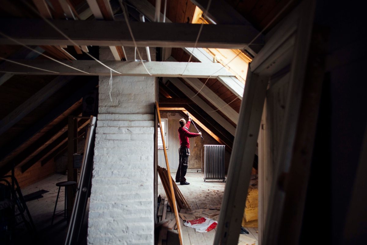 Person renovating an attic space